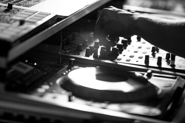 Dj turntables mixing party music in disco black and white