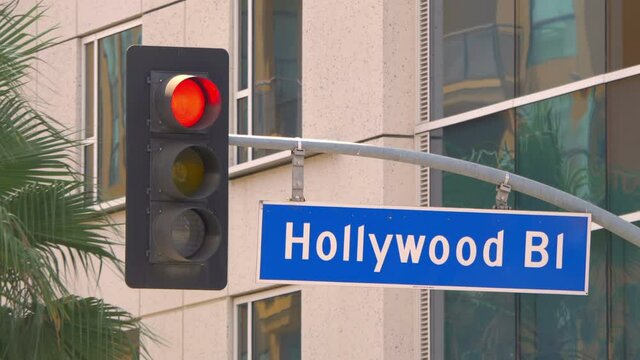 Hollywood boulevard street sign and traffic lights in 4k slow motion 60fps