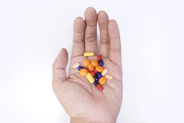 Asian man hand holding many types of pills isolated on white background.  hand, human, holding, pills, healthy,
