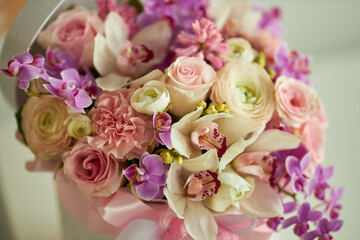 Bouquet of flowers in a white box. Bouquet of delicate flowers. Very beautiful flowers for a postcard.