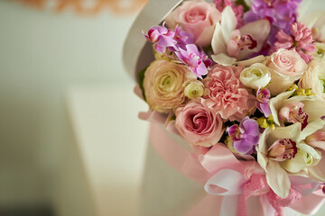 Bouquet of flowers in a white box. Bouquet of delicate flowers. Very beautiful flowers for a postcard.