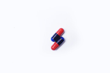 blue and red capsule with shadow  isolated on white background