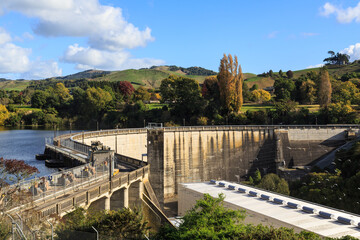 Fototapeta na wymiar The Karapiro Dam on the Waikato River, New Zealand, built in the 1940s. Cars can drive across it using the public road on top