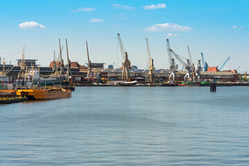 Fototapeta premium The Hansa harbor, located in the Hamburg district Kleiner Grasbrook in the south of the city and the German Port Museum at the quay and the sheds 50