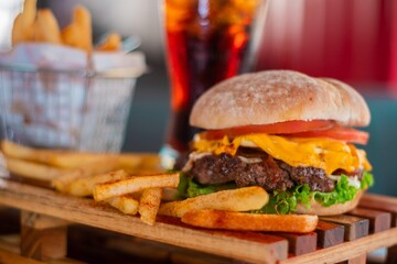 measure fast food, kitchen drinks, Fresh burger and french fries on wooden table