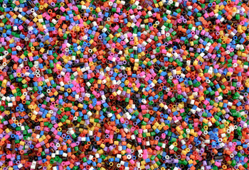 Fototapeta na wymiar Abstract background of close up multi colored beads.