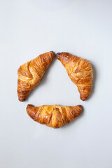 Homemade Chocolate Croissant on white marble.
