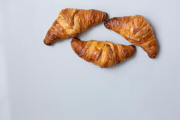 Homemade Chocolate Croissant on white marble.