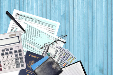 IRS form 1040 Individual income tax return lies on flat lay office table and ready to fill. U.S....
