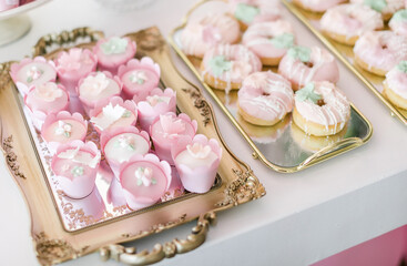 wedding sweets with pink and white frosting