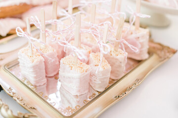 wedding sweets  with pink and white frosting