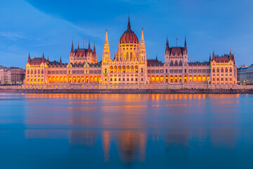 Fototapeta na wymiar Hungarian Parliament, Budapest with reflection in Danube river during twilight