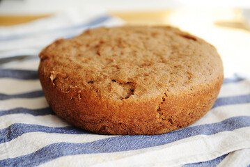 Freshly baked homemade whole grain bread. Round loaf