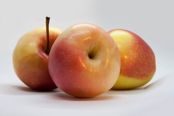 Beautiful ripe apples close-up isolated on a white background