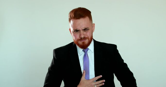 Business man feeling nauseated, redhead person nausea reaction