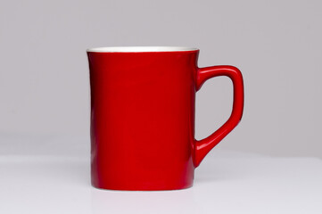 Red coffee cup on the white background