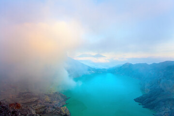 Panoramic view of Kawah Ijen Volcano at Sunrise. The Ijen volcano complex is a group of...