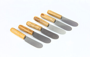 Wooden jam knives isolated on white background