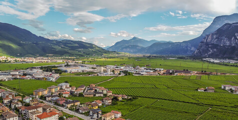 Fototapeta na wymiar aerial view of the village of Mezzocorona in Trentino Alto Adige - northern Italy: charming village in the heart of the Piana Rotaliana Königsberg