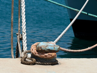 Fototapeta premium Mooring post with ropes at sea harbor