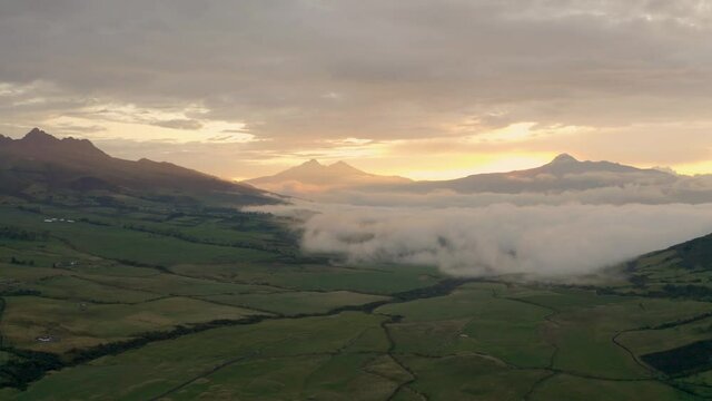 Aerial during sunset around Cotopaxi with clouds rolling in.