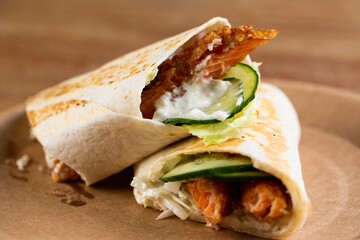 roll with salmon nuggets with fresh vegetables and garlic cream sauce