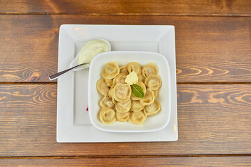 A tray of food on a wooden table