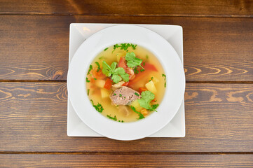 A plate of food on a wooden table
