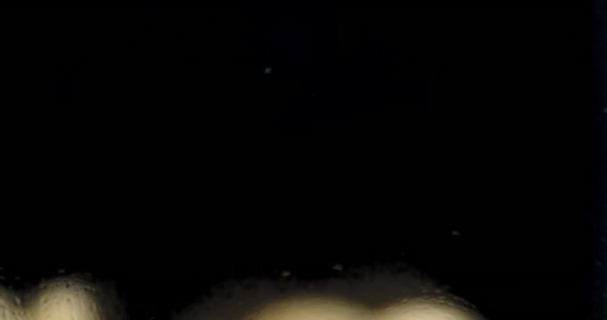 Pasta of dry cavatappi falls on the table.