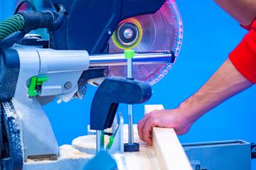 Circular saw for wood with built-in vacuum cleaner. Sawing of wooden workpieces. Woodworking. Wood...