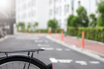 Background blurred. Bicycles parked in front of apartments in Japan..