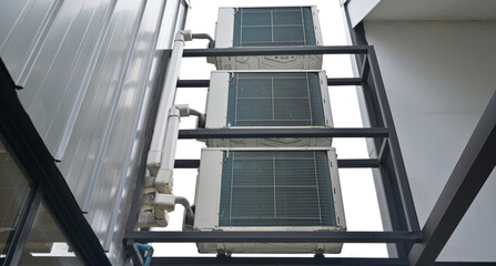 Installed air condenser outside the building.