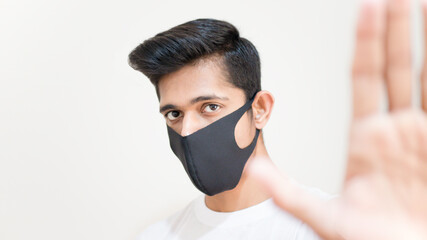 young man with a black mask stopping someone, black people, black lives matter