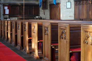 Rows of empty pews in a church
