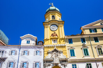 Fototapeta na wymiar City of Rijeka, Croatia. Baroque city clock tower on a sunny summer day. 