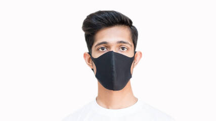 Smart boy wearing black mask to protect himself from the flu and diseases corona virus covid 19, black surgical mask, close up, boy looking in camera, black mask doctor, selective focus