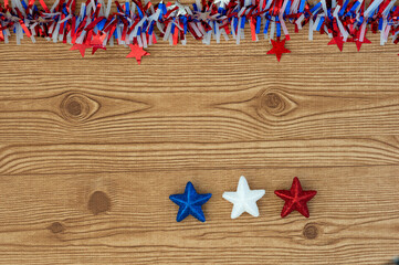 Independence Day July 4th, President's Day, Memorial Day, Labor Day, Veteran's Day, Great America. Blue, white and red stars in representation of the united states flag colors on a wooden background.