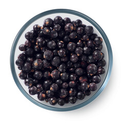 Frozen blackcurrant berries in a glass plate on a white background. Isolated frozen berries. Top view