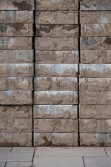 The paving stone is folded in several rows. Dismantled dirty tile lies on the sidewalk. Repair work. Improvement of roads and sidewalks.