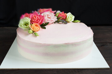 Cake with flowers.Cake decorated of fresh roses.Space for text