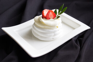 Pavlova cakes  decorated fresh strawberries. Meringue cake with whipped creame