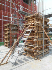 MALACCA, MALAYSIA -SEPTEMBER 19, 2016: Column timber formwork and reinforcement bar at the construction site in Malacca, Malaysia. The structure supported by temporary wood support