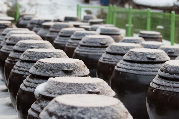 The jar is covered with snow.
