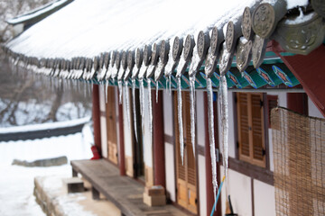 There are icicles on the roof.