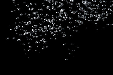 Water bubbles isolate on black background.