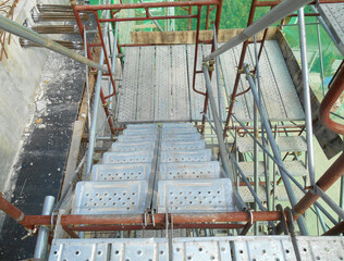 MALACCA, MALAYSIA -SEPTEMBER 23, 2016: Temporary access and staircase supported by reinforced scaffolding at the construction site. Used by construction workers.  