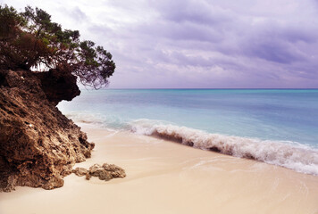 Beautiful sea wave and white sand beach Zanzibar, Tanzania.