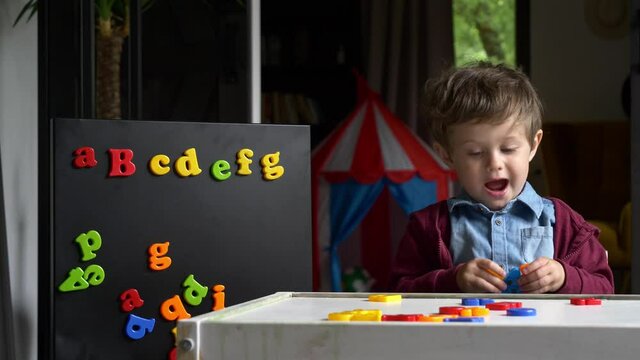 Preschool boy learning ABC at home education