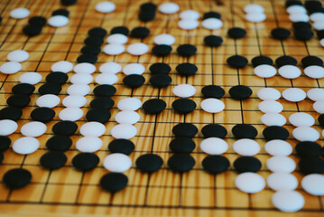 Traditional asian strategy board game. black and white stone, Desk for board game Go or wei-Chi