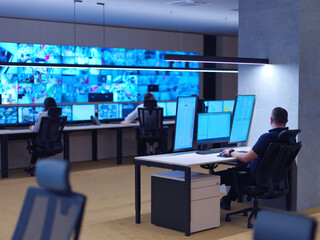 male operator working in a security data system control room